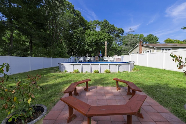 view of patio featuring a fenced in pool