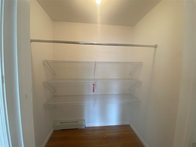 pantry featuring a baseboard heating unit