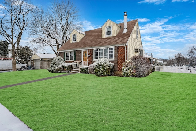 new england style home featuring a front lawn