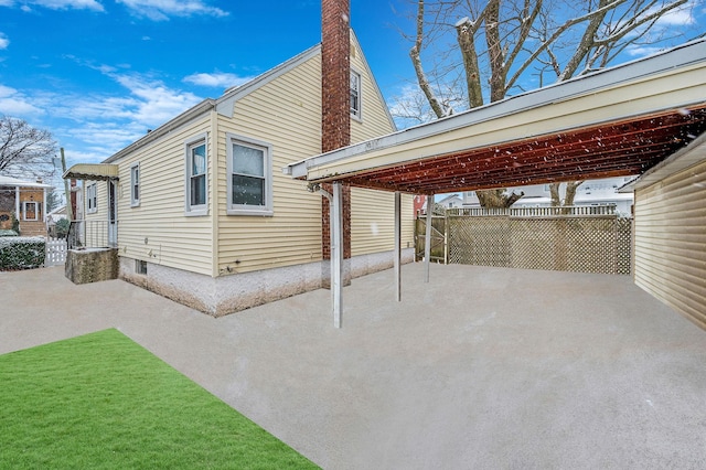 exterior space featuring a carport