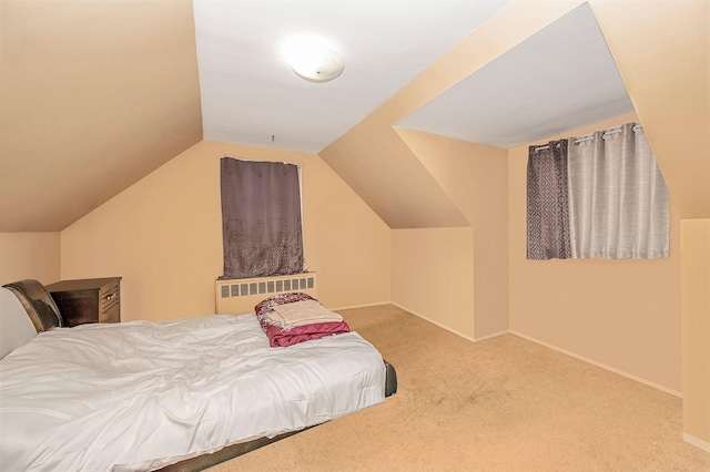 bedroom featuring carpet flooring and lofted ceiling