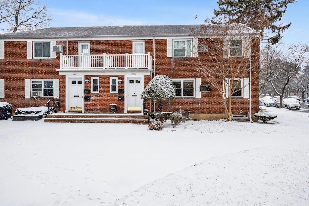 view of front of home with a balcony