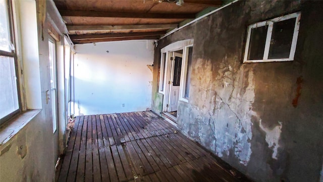 interior space featuring beamed ceiling, wooden ceiling, and hardwood / wood-style floors