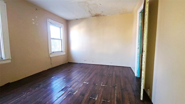 spare room featuring dark hardwood / wood-style floors