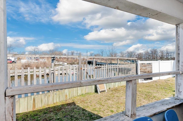 wooden deck featuring a water view