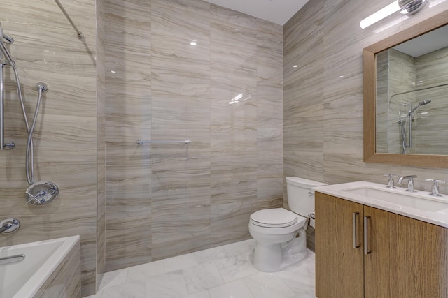 full bathroom with vanity, tiled shower / bath, tile walls, and toilet