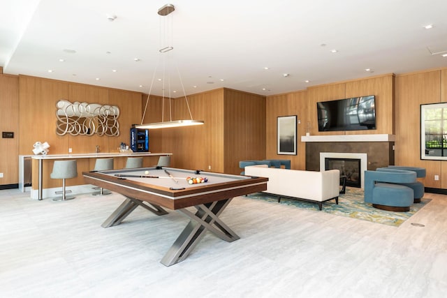 playroom with pool table, wood-type flooring, and wood walls