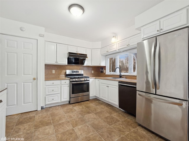 kitchen featuring white cabinetry, extractor fan, stainless steel appliances, backsplash, and sink