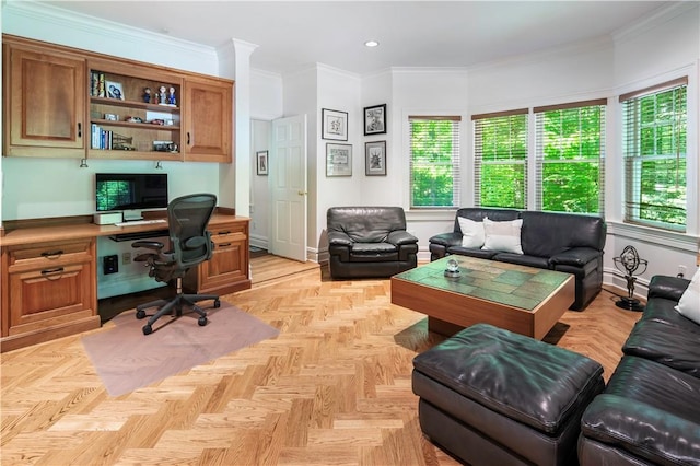 home office with built in desk, ornamental molding, and light parquet flooring