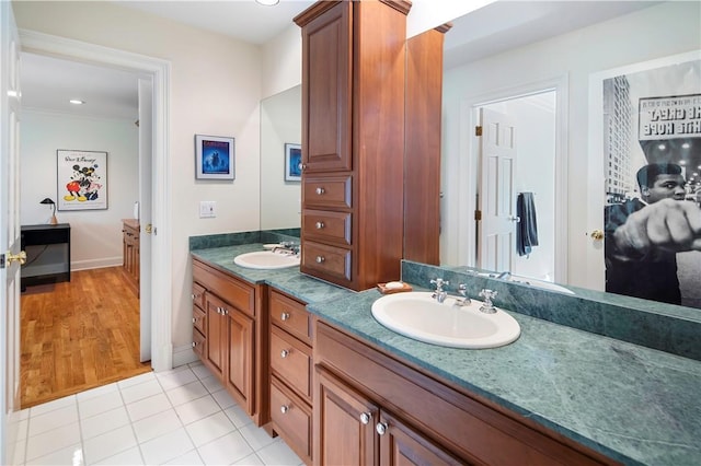 bathroom featuring tile patterned flooring and vanity