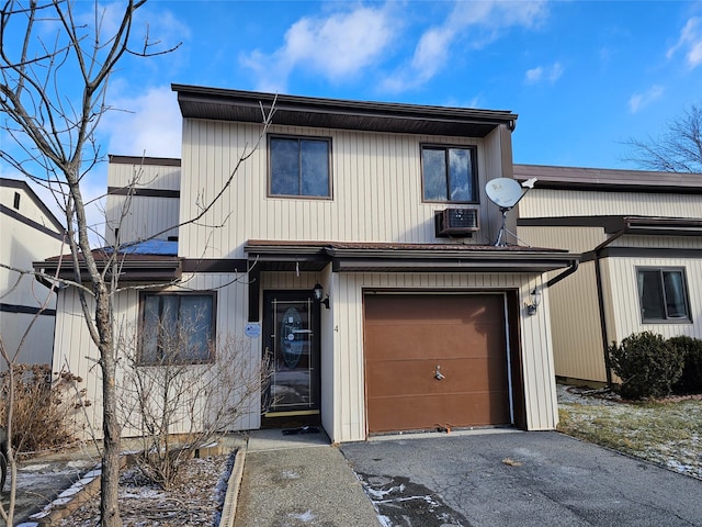 townhome / multi-family property with a garage