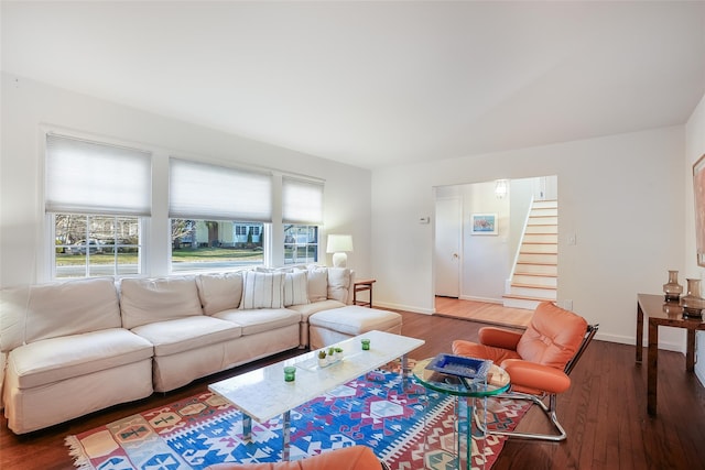 living room with dark hardwood / wood-style flooring