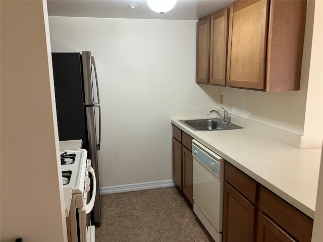 kitchen with white appliances and sink