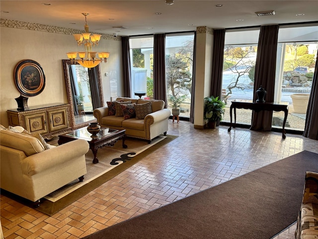 living room with a wall of windows and an inviting chandelier