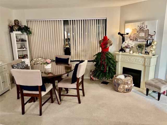 dining area with light colored carpet