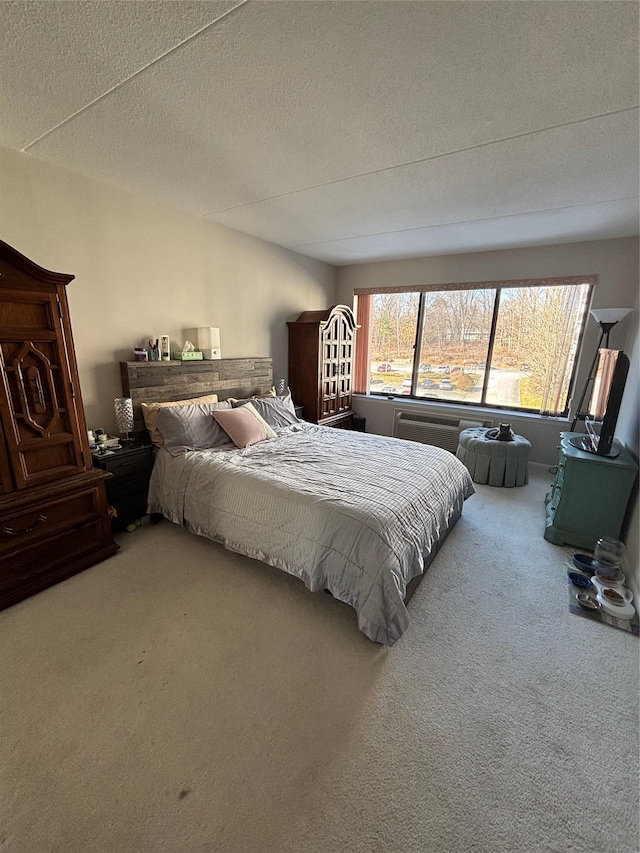 bedroom featuring a textured ceiling and carpet floors