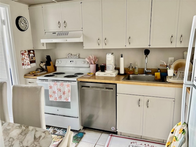 kitchen with stainless steel dishwasher, sink, electric stove, white cabinetry, and light tile patterned flooring