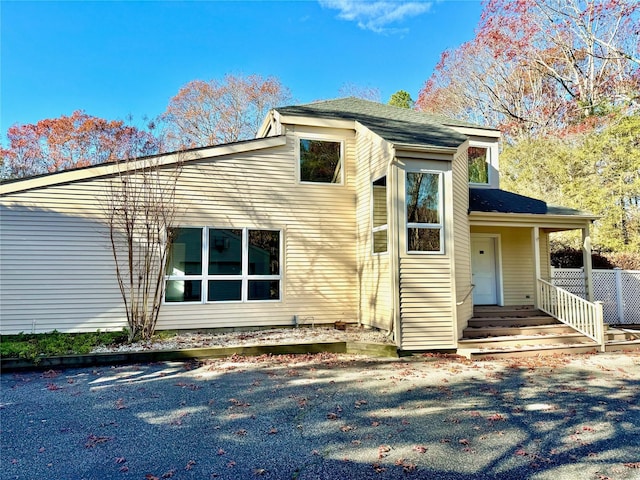 view of side of property with a porch