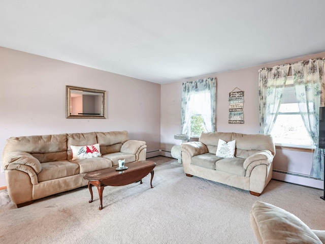 living room featuring carpet flooring, a healthy amount of sunlight, and a baseboard heating unit