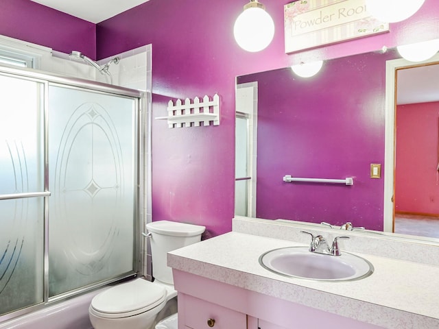 full bathroom with vanity, toilet, and enclosed tub / shower combo