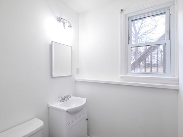 bathroom featuring vanity and toilet