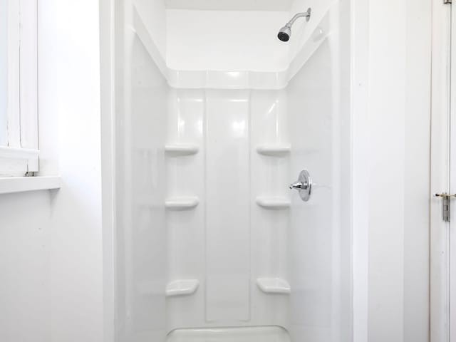 bathroom featuring walk in shower