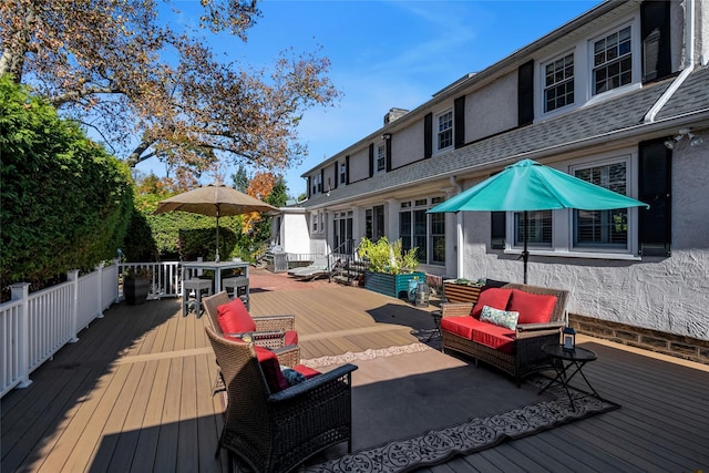 wooden deck featuring an outdoor living space