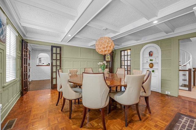 dining area with beam ceiling and plenty of natural light