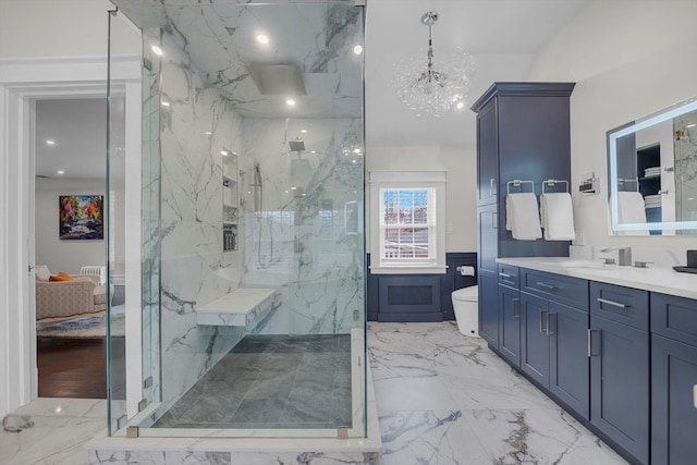 bathroom featuring an inviting chandelier, vanity, toilet, and walk in shower