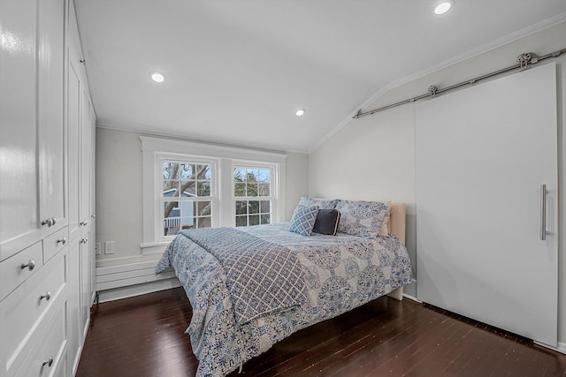 bedroom featuring ornamental molding, lofted ceiling, and dark hardwood / wood-style floors