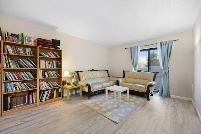 living area with light hardwood / wood-style floors