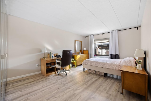 bedroom with light wood-type flooring