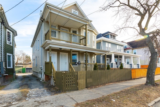 view of front of house featuring a balcony and covered porch