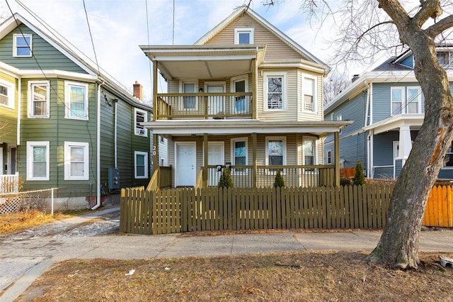 front of property with a porch and a balcony