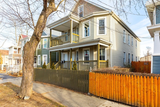 view of front of house with a porch and a balcony