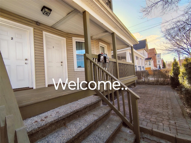 property entrance featuring covered porch