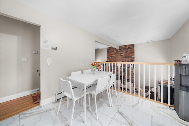 dining space featuring beamed ceiling