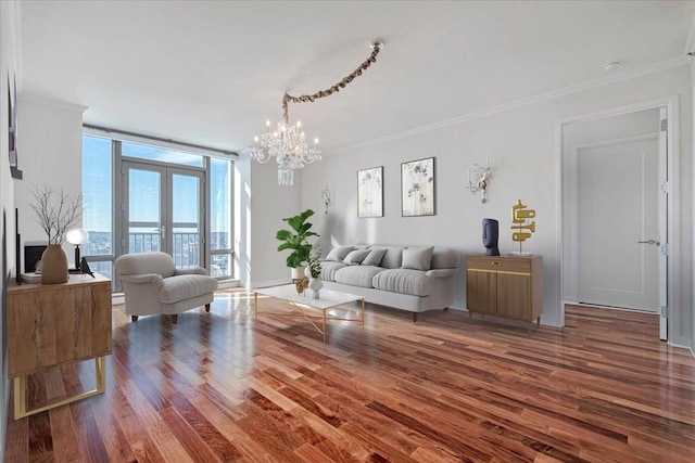 living room with an inviting chandelier, floor to ceiling windows, wood-type flooring, ornamental molding, and french doors