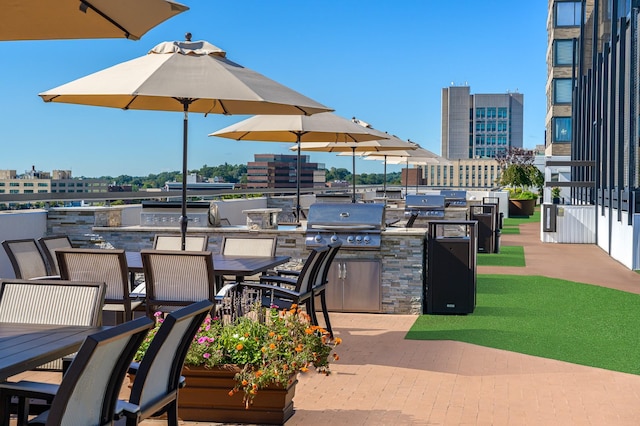 view of patio / terrace with an outdoor kitchen and grilling area