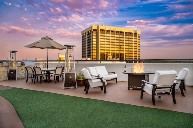 patio terrace at dusk with a fire pit