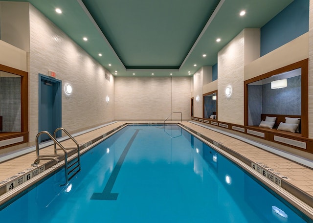 view of pool with elevator