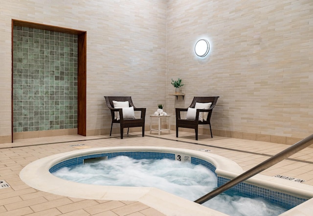 view of swimming pool featuring an indoor in ground hot tub and a patio