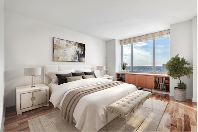 bedroom featuring wood finished floors