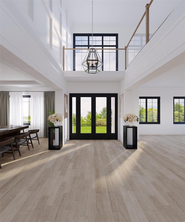 LOT11003 Baldwin Path, Dix Hills, NY 11746 - foyer entrance with a high ceiling, wood finished floors, and a chandelier