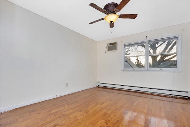 spare room featuring a wall mounted air conditioner, light hardwood / wood-style floors, baseboard heating, and ceiling fan