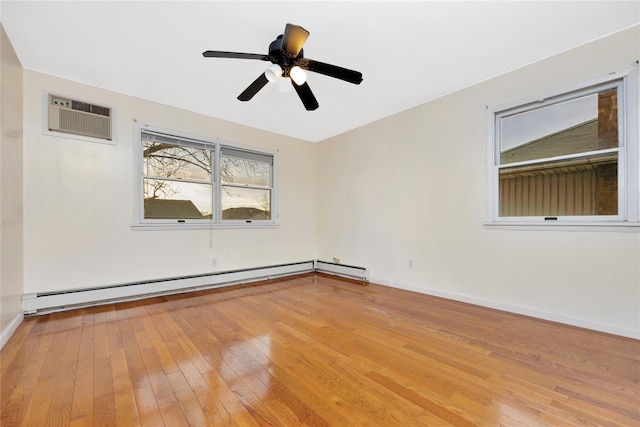 empty room with light hardwood / wood-style flooring, a wall mounted AC, a baseboard heating unit, and ceiling fan