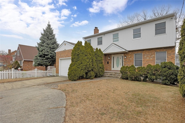 view of property featuring a front lawn