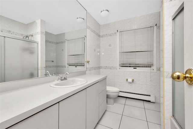 full bathroom featuring vanity, tile patterned flooring, toilet, baseboard heating, and tile walls