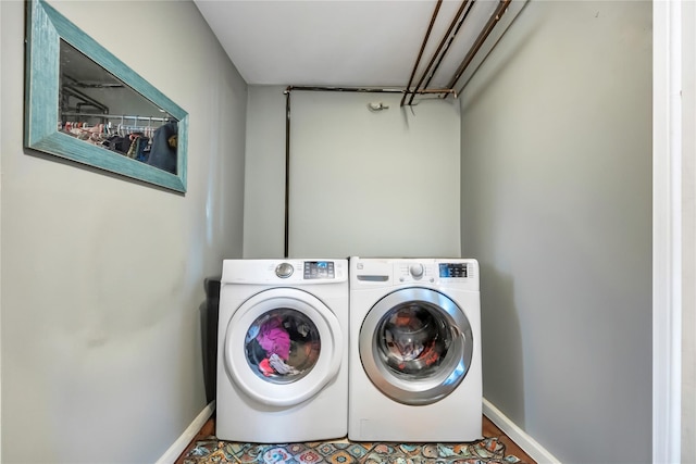 laundry room with washer and dryer