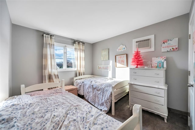 carpeted bedroom with a wall mounted air conditioner